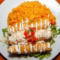 Tacos Dorados · Three deep fried rolled corn tortillas stuffed with chicken topped with lettuce, sour cream,...