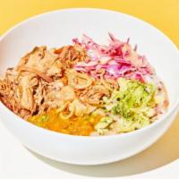 Chicken Congee · Slow braised chicken, sesame cabbage, shaved broccoli, and crispy shallots over a soft cream...