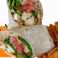 Chicken Caesar Wrap · Grilled chicken served over lettuce, tomato, onions, shaved Parmesan cheese and Caesar dress...