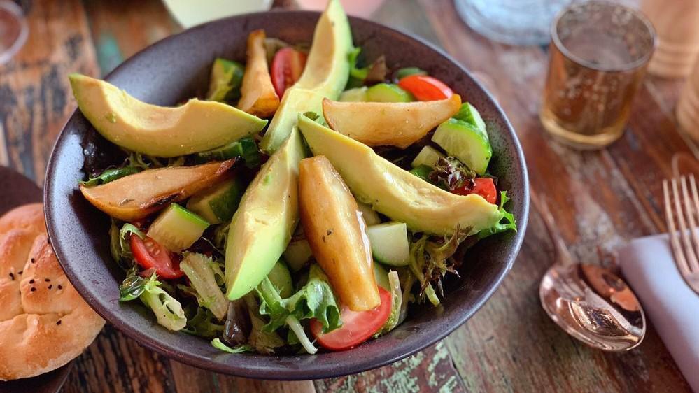 Avocado Salad With Caramelized Pear · Fresh mixed greens, avocados, cucumbers, cherry tomatoes, caramelized pear with extra virgin olive oil, lemon juice, and vinegar.