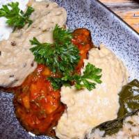 Meze Platter (Small) · Hummus, babaganoush, grape leaves, artichoke, spicy vegetables.