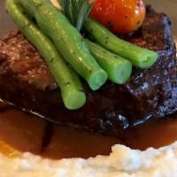 Filet Mignon · A center cut of beef filet mignon served with French beans over cheesy mashed potatoes with ...