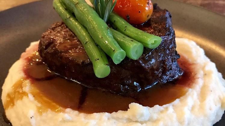 Filet Mignon · A center cut of beef filet mignon served with French beans over cheesy mashed potatoes with demi-glace sauce.