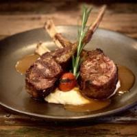 Lamb Chops · Grilled lamb chops over creamy puréed eggplant.