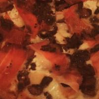 St Nic Pizza · Mozzarella, Gorgonzola, Grana, ricotta, prosciutto, mushroom and truffle oil.