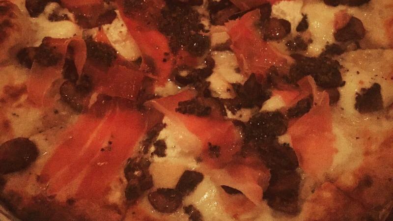 St Nic Pizza · Mozzarella, Gorgonzola, Grana, ricotta, prosciutto, mushroom and truffle oil.