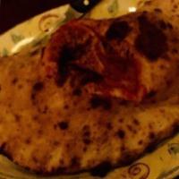 Calzone · Mozzarella, ricotta, tomato sauce, hot soppressata and mushrooms.