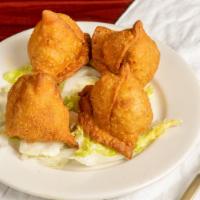 Vegetable Samosa · Turnoverstuffed with smashed potatoes, peas and spices.