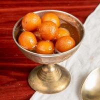 Gulab Jamun · Deep-fried milk ball in honey sugared syrup, scented with rosewater.