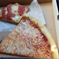 Brooklyn Pizza · Thin crust square covered in our garlic knot spread, spices, mozzarella and topped with our ...