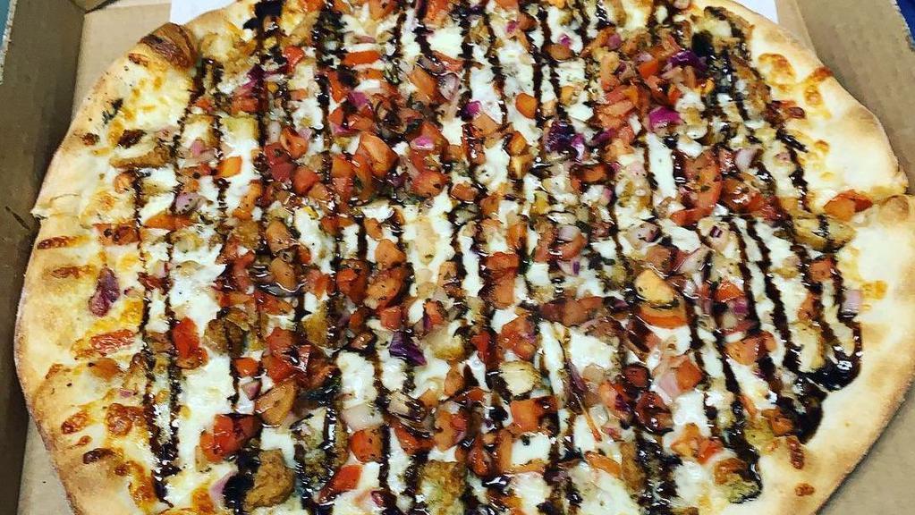 Chicken Bruschetta Pizza · Tomatoes, fresh mozzarella, roasted red peppers and fried chicken topped with balsamic drizzle.