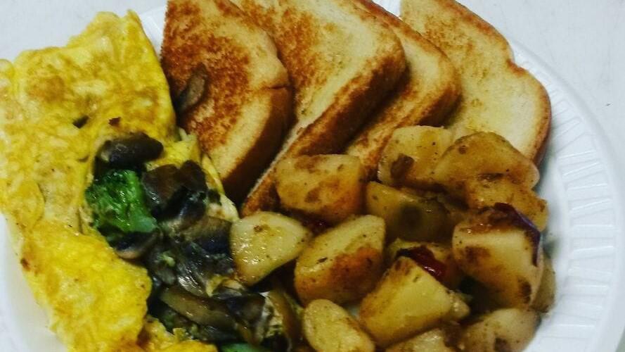 Veggie Omelet · With Onions, Peppers, Tomato, Mushroom & Spinach, Served with Potatoes & toast.