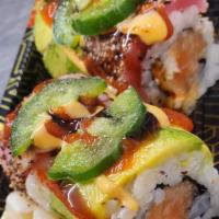 Volcano Roll #56 · Spicy salmon, spicy kani, crunch, topped with black pepper tuna, avocado, jalapeño, and sauc...