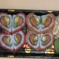 Valentines Roll #54 · Crunchy spicy salmon, avocado, wrapped with tuna and salmon, heart shaped.