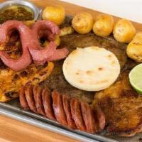 Parrillada Milina · Grilled beef, grilled chicken, grilled pork, chorizo, arepa, Colombian potatoes, and sausage.