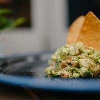 Guac & Chips · MADE FRESH with avocado, tomato, jalapeños, spices and lime. Served with fresh tortilla chips.