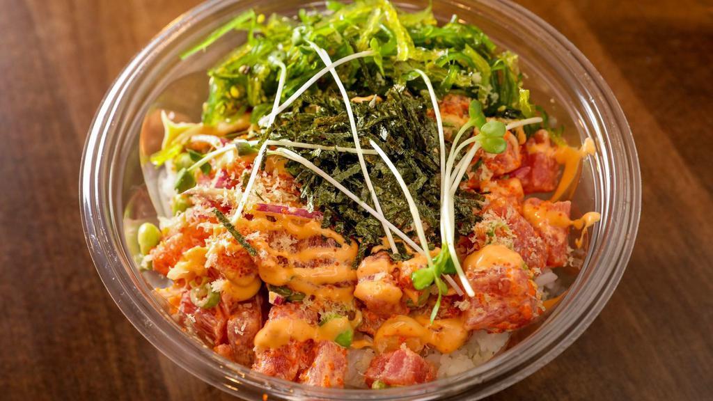 Spicy Ahi · Ahi tuna, scallion, seaweed salad, masago, radish sprouts, red onion, edamame, kizami nori, tempura flakes, and sriracha aioli. Includes romaine lettuce and mixed green.