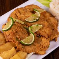 Pescado Frito (Filete) · Two fried tilapia fish served with white rice, fried cassava, homemade salad and topped with...