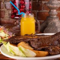 Churrasco (Chuck Steak) · Tender chuck steak marinated in our special parrilla sauce and cooked on the grill with your...