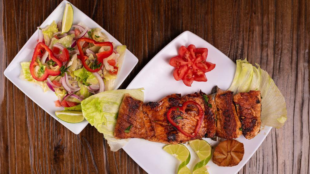 Salmon · Grilled seasoned salmon accompanied with your choice of two sides.