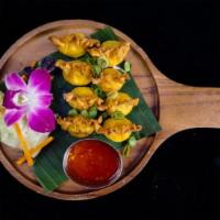 Crab Rangoon · Crab meat and cheese wrapped with crispy wonton which served with homemade-thai sweet chilI ...