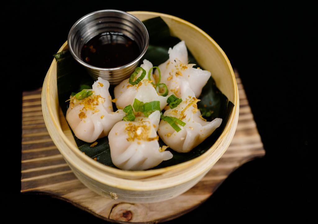 Steam Shrimp Dumpling · Steam shrimp dumpling topped with crunchy garlic ,served with soy vinaigrette