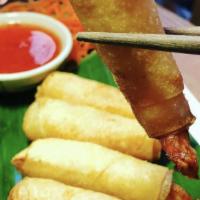 Crispy Shrimp Roll · Deep fried wrapped shrimp with rice paper and served with plum sauce.