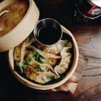 Steam Chicken Dumpling · Steam chicken dumpling topped with crunchy garlic ,served with soy vinaigrette