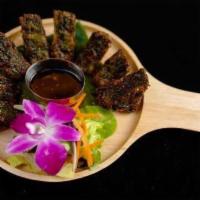 Kui Chai · Fried chive vegetable dumpling with Thai dipping sauce.