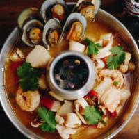 Tom Yum Shrimp Soup · Spicy lemongrass broth with shrimp, mushroom, scallion and cilantro. Hot and spicy.