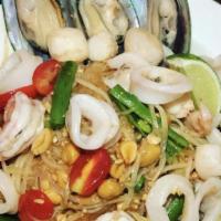 Papaya Salad With Seafood · Green papaya, tomato, peanut, and long bean in spicy lime dressing. Mixed with seafoods. Hot...