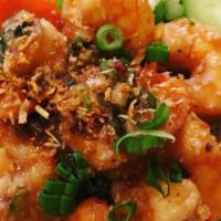 Pad Kra Tiem (Garlic Sauce) · Garlic, onion and scallion served over steamed mixed vegetable.