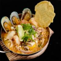 Tom Yum Noodle Soup · With scallion, chili, lemongrass, galanga, lime leaf in spicy tom yum broth top with egg. Ho...