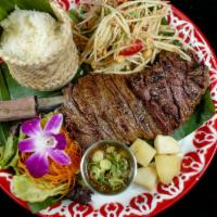 Grilled Skirt Steak (16 Oz.)5-Spiced Sauce · Grilled marinated skirt steak with thai herb style on topped 5-Spiced homemade. jaew sauce