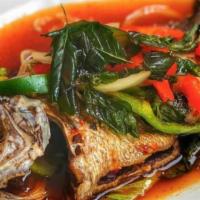 Whole Fish Red Snapper With Three Flavors Sauce · Fried whole fish topped with garlic, onion and bell pepper with homemade tamarind chili sauce.