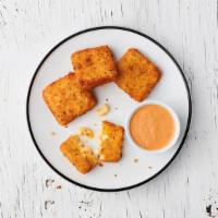 Toasty Mac Bites · Golden-fried mac & cheese bites served with Society Sauce for dunking (comes with 4)