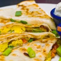 Breakfast Quesadilla · Classic folded tortilla wrap filled with egg and cheese and with your choice of honey turkey...