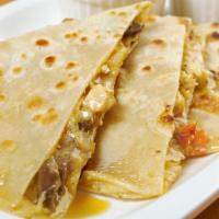 Philly Cheese Steak Quesadilla · Classic folded tortilla filled with Philly style steak, onions, pepper, and cheese.