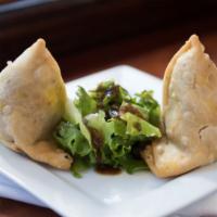 Vegetable Samosa · Vegetarian. Seasoned potatoes and green peas wrapped in a crispy pastry.