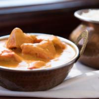 Chicken Tikka Masala · Boneless cubes of chicken cooked in tandoor and finished off with yogurt and creamy tomato s...