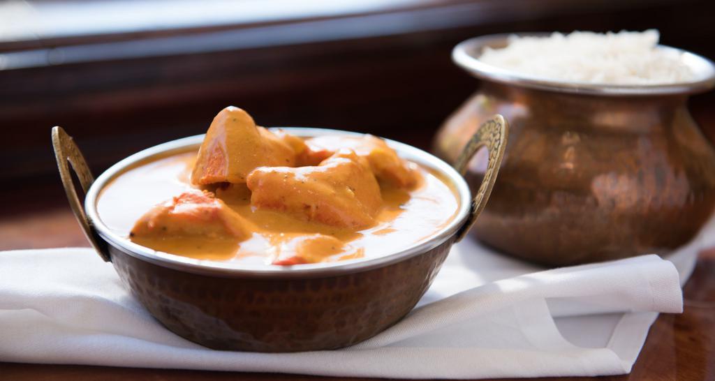 Chicken Tikka Masala · Boneless cubes of chicken cooked in tandoor and finished off with yogurt and creamy tomato sauce.
