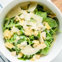 Arugula Salad · Arugula, parmesan, artichokes, honey lemon dressing