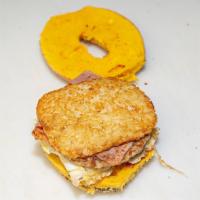 Hungry Man On A Bagel · 2 Eggs, Ham, Bacon, Sausage, Cheese and a Hash brown on a bagel