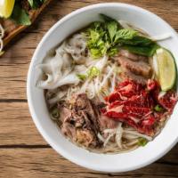 House Pho Noodle Soup · Comes with rare eye round, brisket, tripe and tendon, with rice noodles, served with beef br...