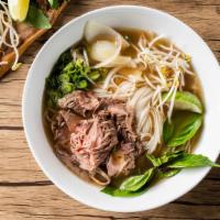 Cooked Beef Pho Noodle Soup · Cooked beef with rice noodles, served with beef broth, onions, scallions, and lemon, basil &...
