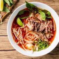 Spicy Beef Pho Noodle Soup · Cooked beef with rice noodles, served with spiced beef broth, onions, scallions, and lemon, ...