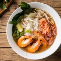 Seafood Pho Noodle Soup · Shrimps with rice noodles, served with pho broth soup, onions, scallions, and lemon, basil &...