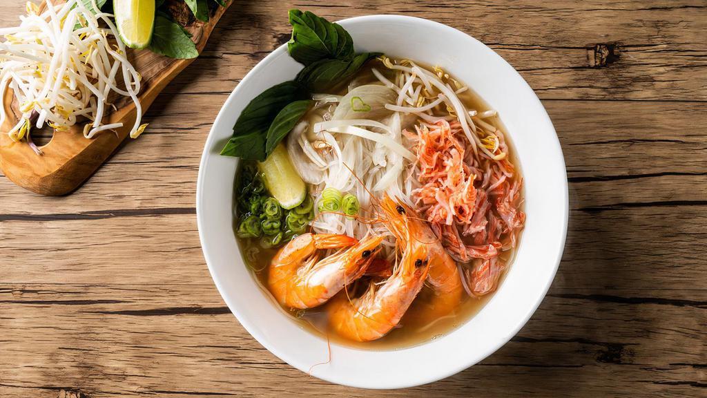 Seafood Pho Noodle Soup · Shrimps with rice noodles, served with pho broth soup, onions, scallions, and lemon, basil & bean sprouts on the side.