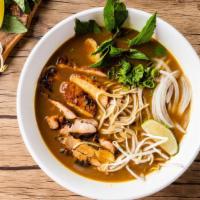 Curry Chicken Pho Noodle Soup · Grilled chicken with rice noodles, served with curry flavor broth, onions, scallions, and le...