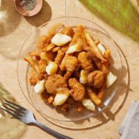 Chicken Poutine · Fresh cut french fries topped with crispy chicken bites, cheese curds, and gravy.